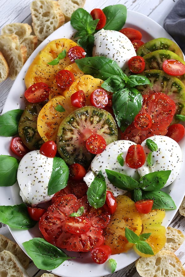 Caprese Salad with heirloom tomatoes, burrata and basil.
