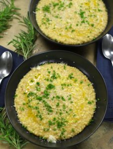 Overhead photo of two bowls of Chickpeas and Pasta garnished with chives.