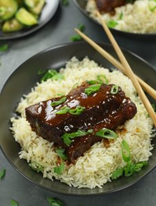 Asian Braised Beef Short Ribs served on white fluffy rice.